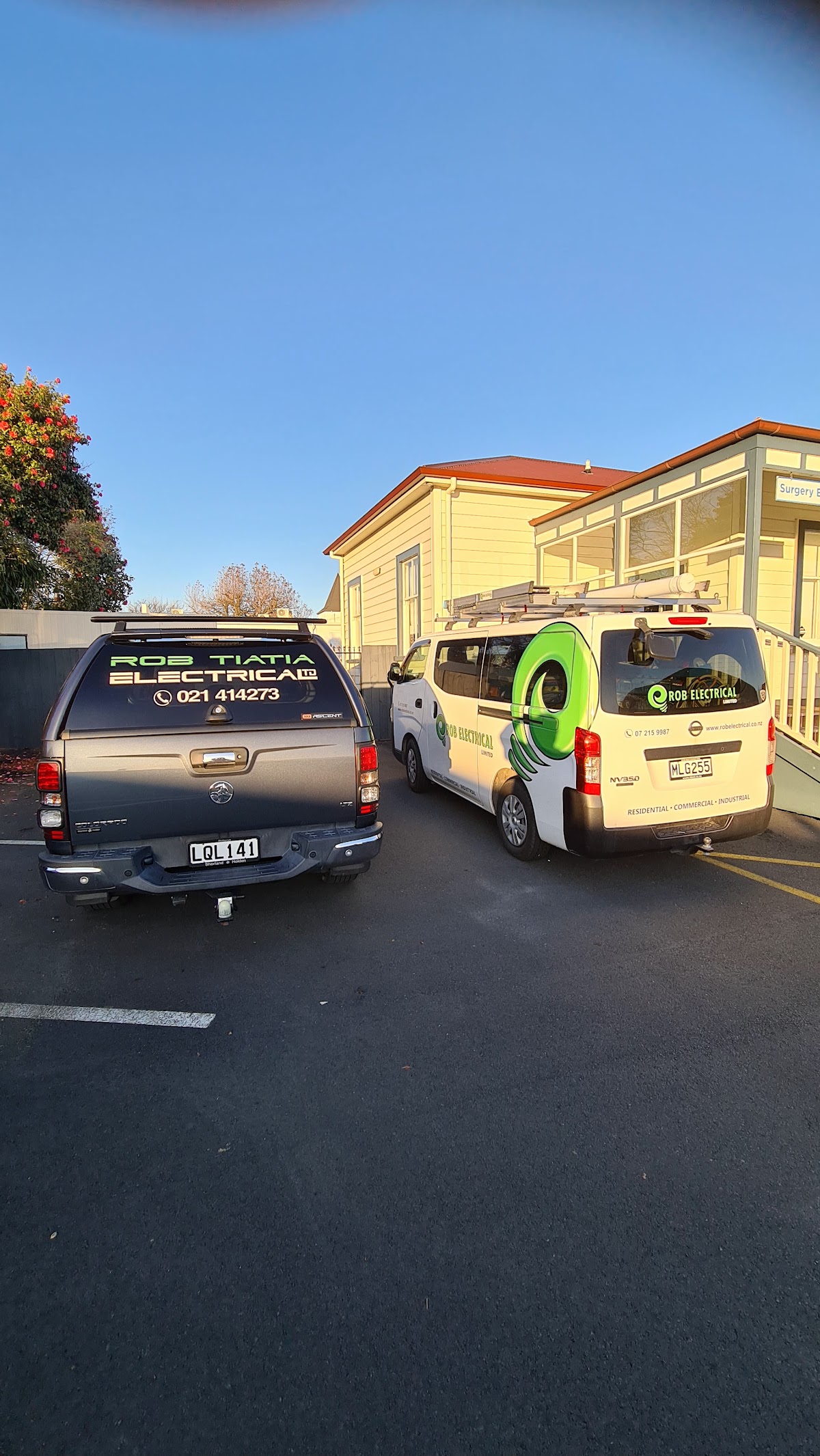 Rob Tiatia Electrical signwritten ute and van at a job