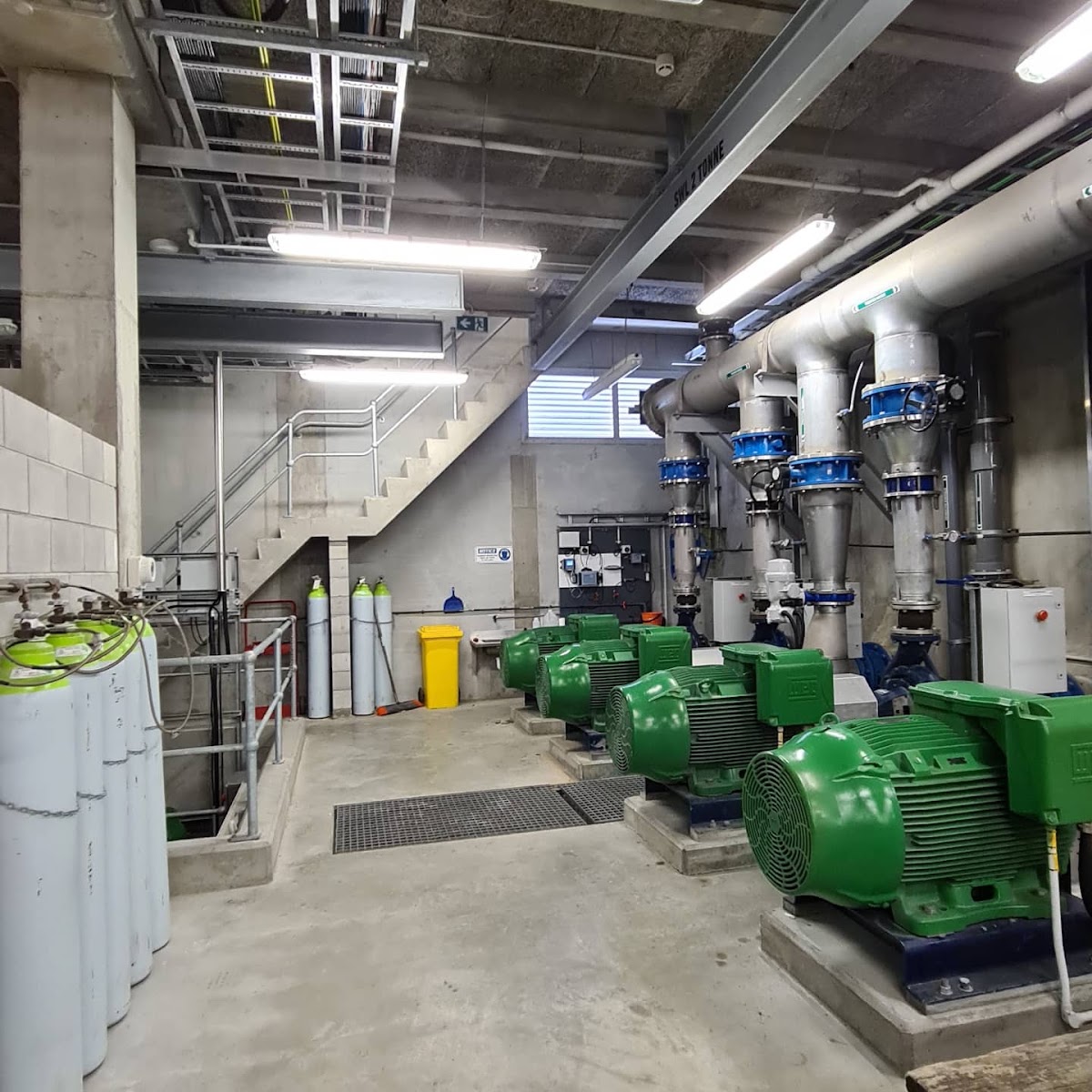Industrial plant room with pumps and new lighting